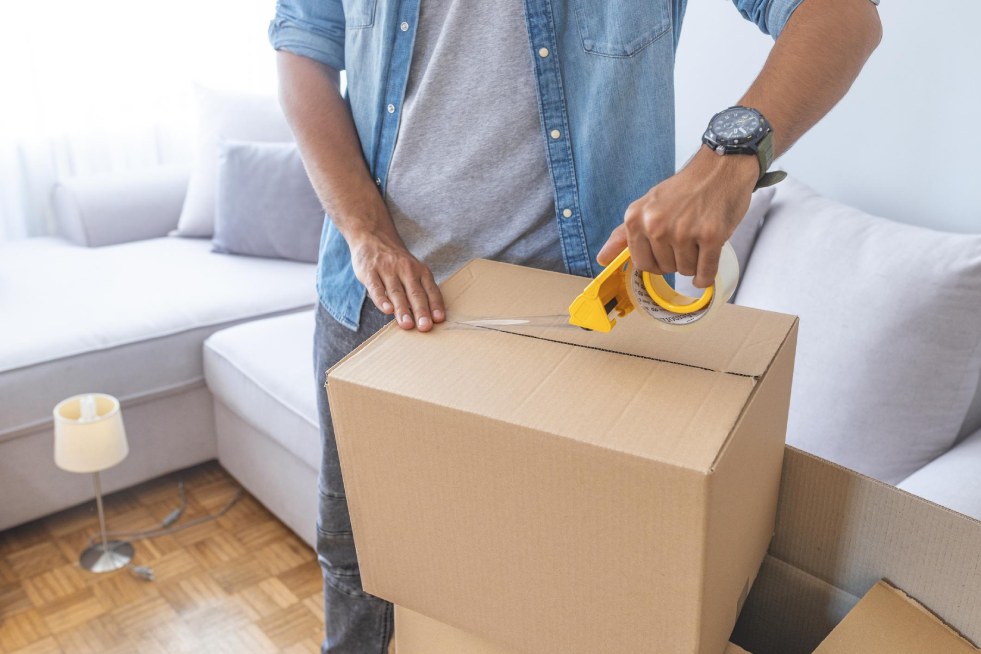 a man packing a box