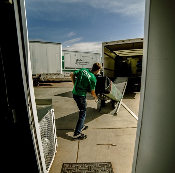 a man moving in things in a truck