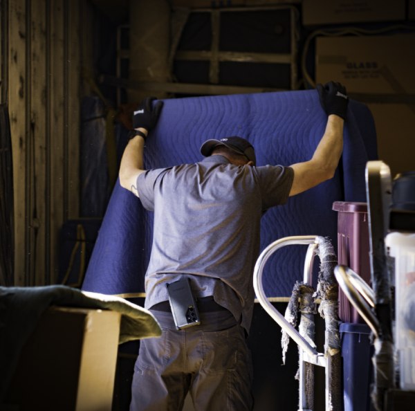 a person holding a blue sheet