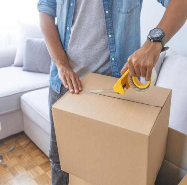 a man packing a box