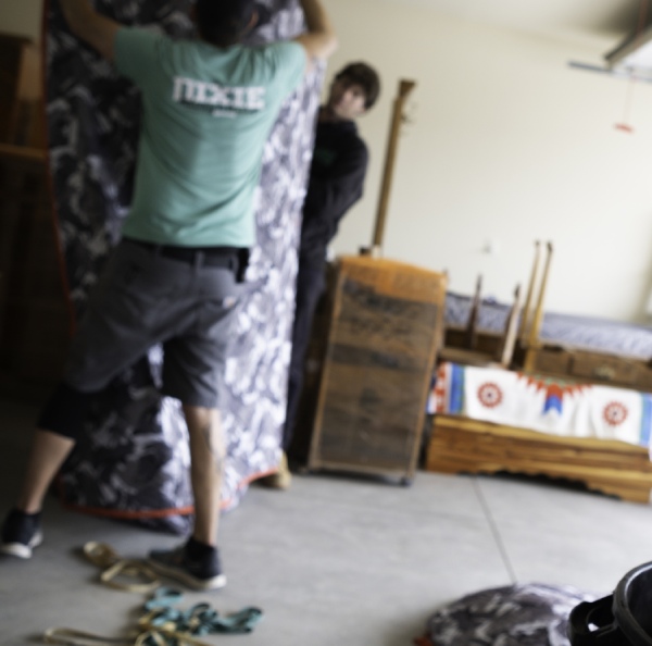 two men moving an wardrobe