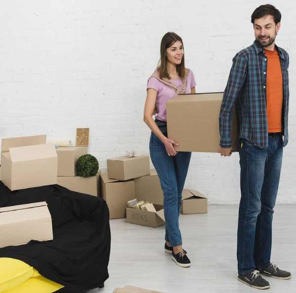 a girl and boy holding a box