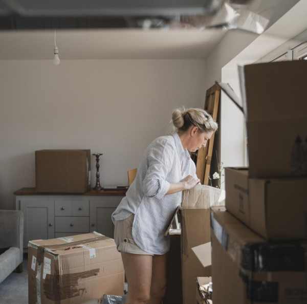 a woman opening a box