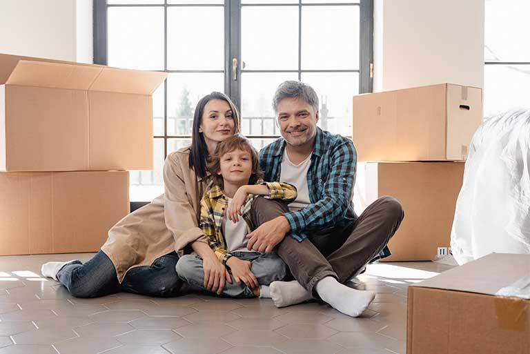 a family sitting on the floor