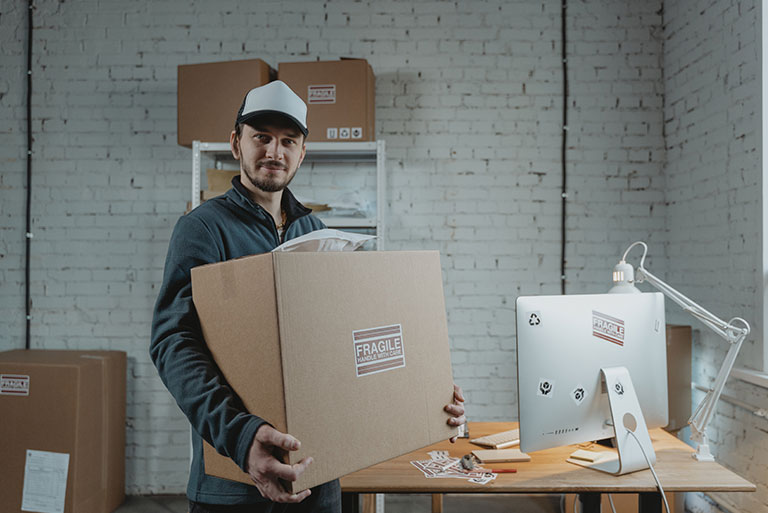 a boy carrying a box