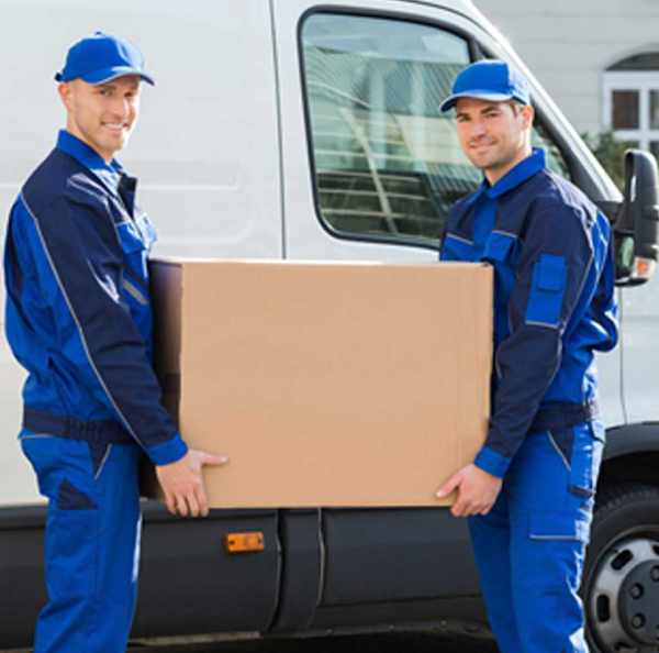 two men carrying a box