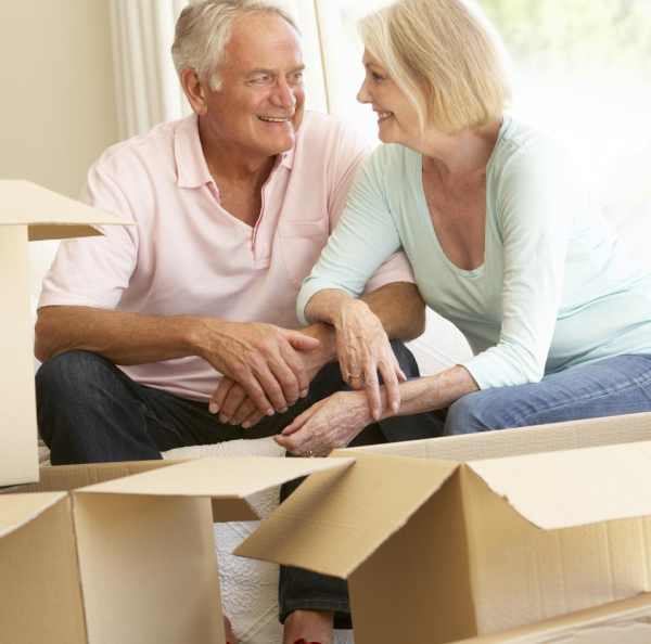 a man and woman sitting on the floor